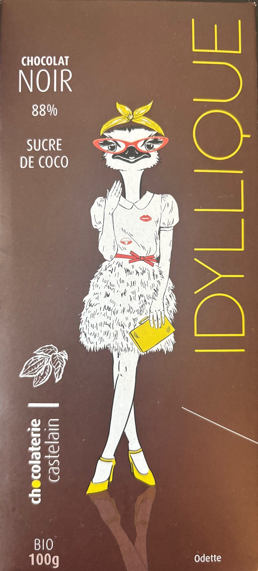 Front packaging of Idyllique Noir 88% with image of a bird dressed as a woman